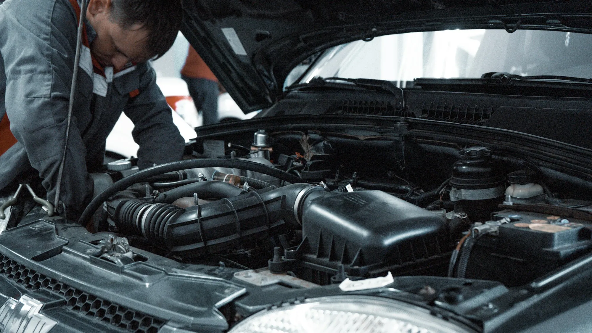 Workshop interior with a vehicle lift and diagnostic equipment