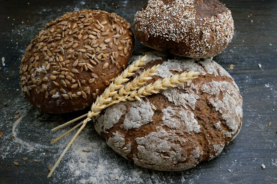 A bakery or pastry shop website showing a counter of fresh bread and pastries with an order button