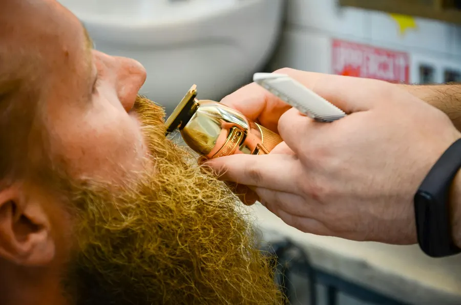 A full beard sculpted with sharp lines