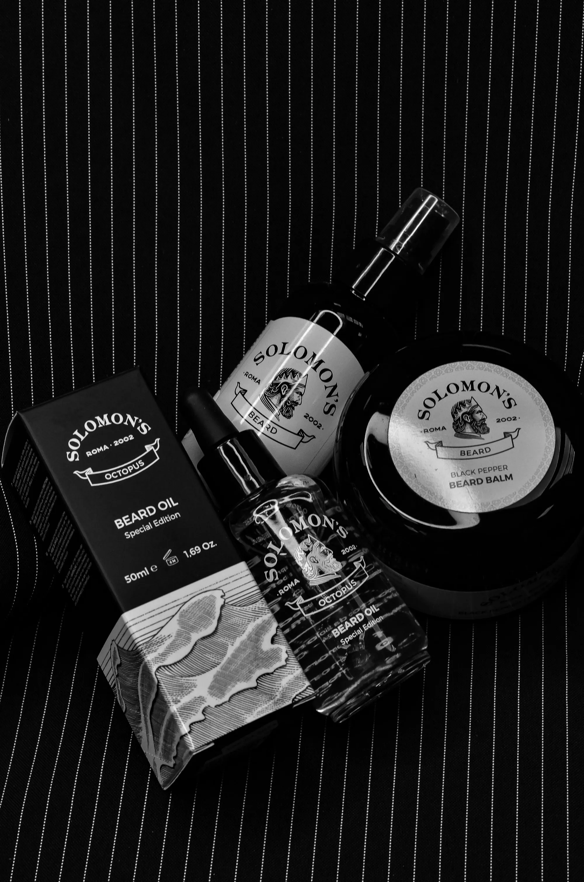 Grooming products: pomade, beard oil and a comb