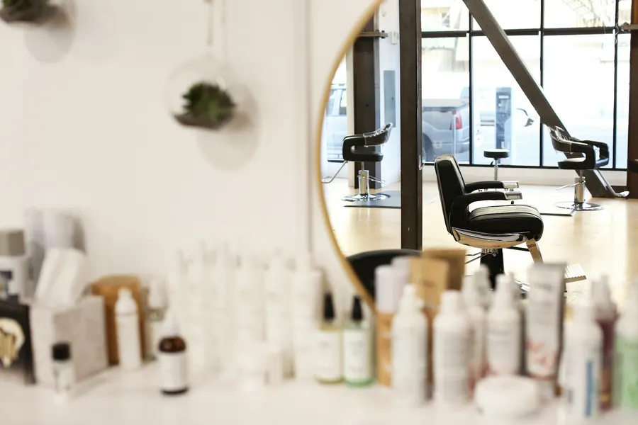 Professional products and a round mirror in the salon
