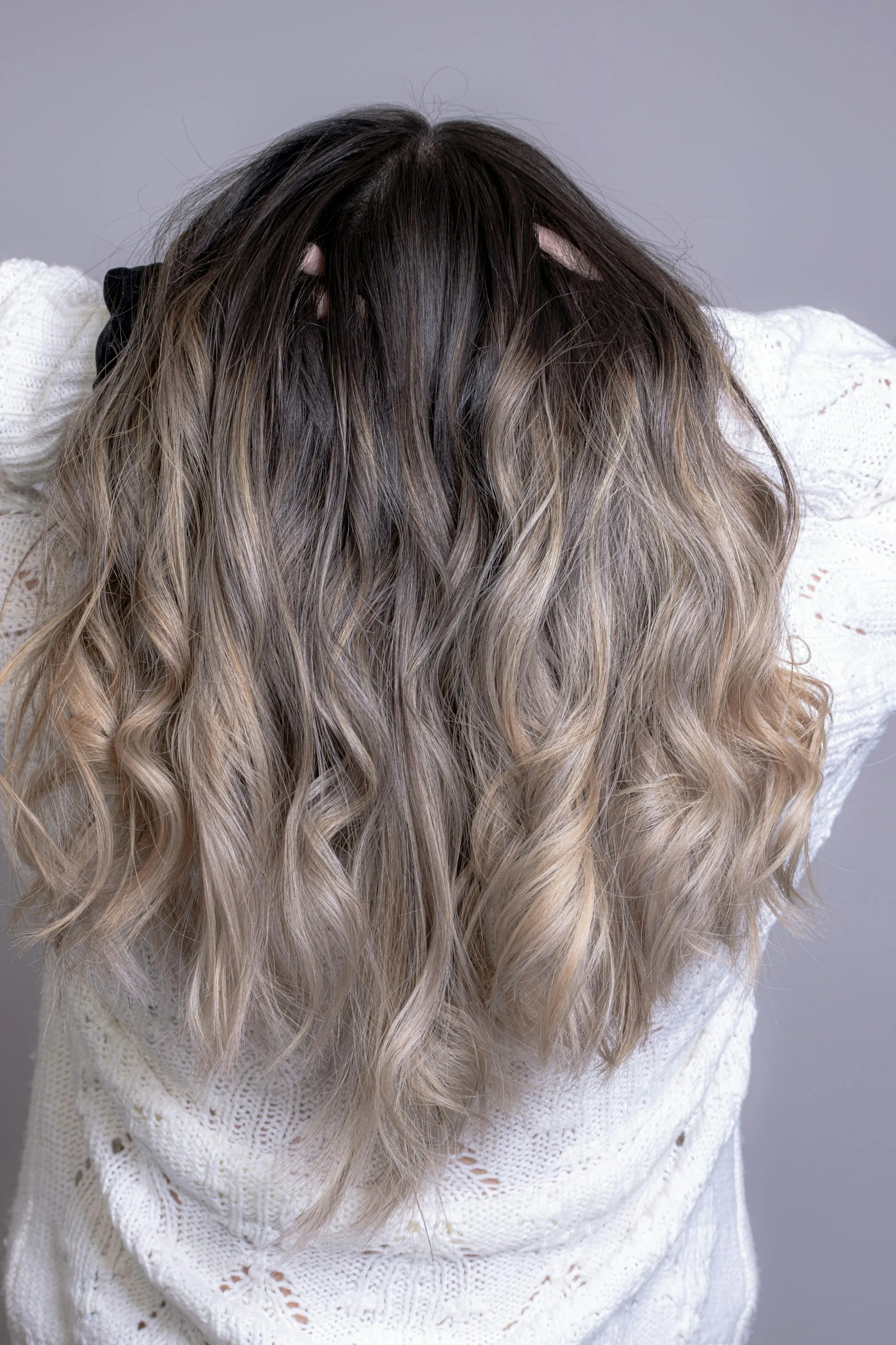 Long hair with a blonde balayage created in the salon