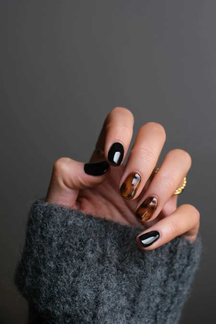 Elegant manicure with black and tortoiseshell polish