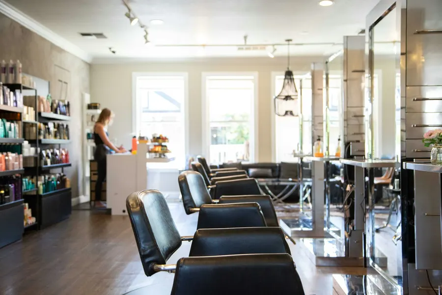 Bright salon interior with chairs and mirrors