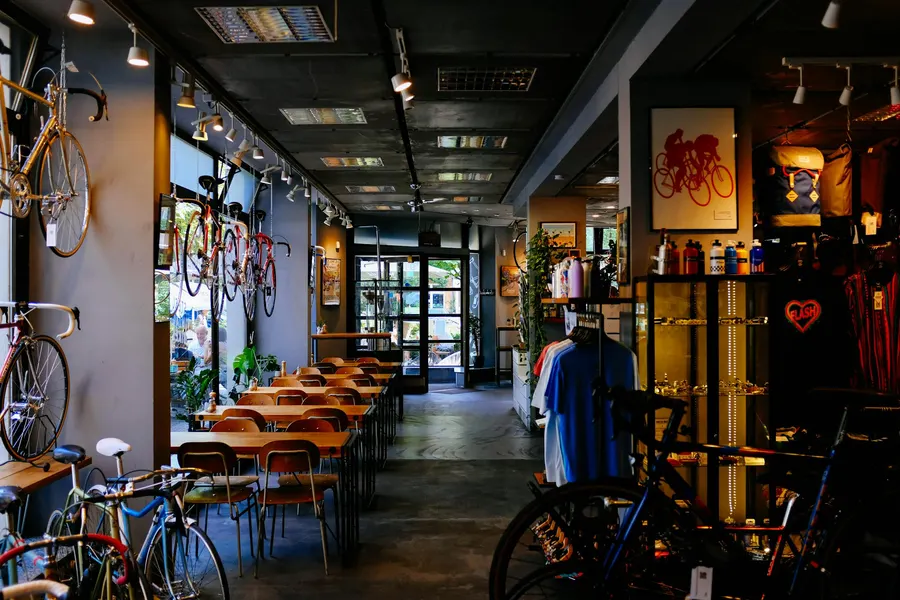 A bicycle shop and workshop website showing the bike catalogue with filters and a repair booking form