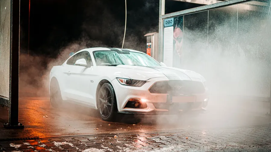 A car detailing website with a before-and-after gallery, packages priced by vehicle size and online booking