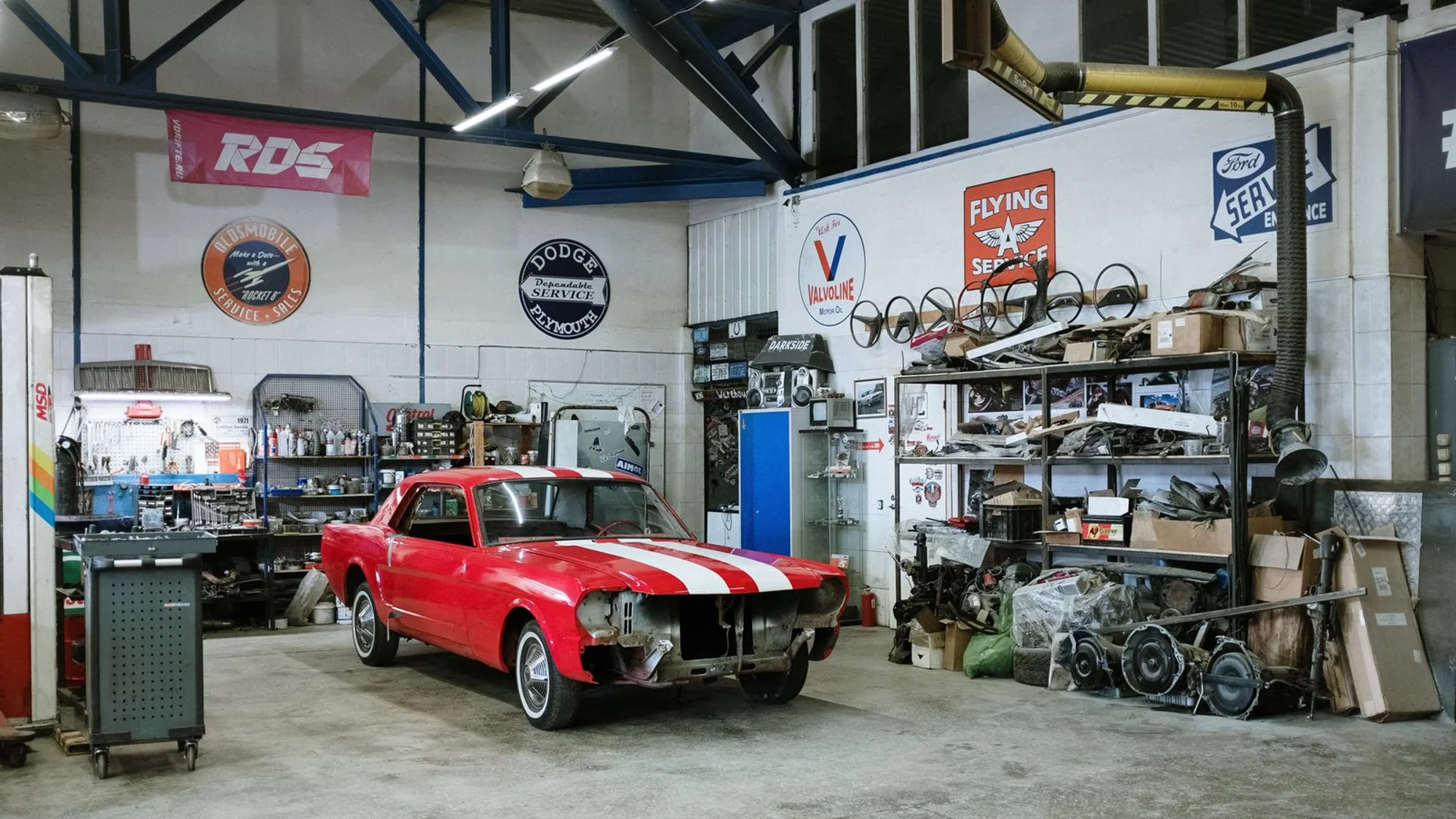 Detailing studio interior with a bay and inspection lighting