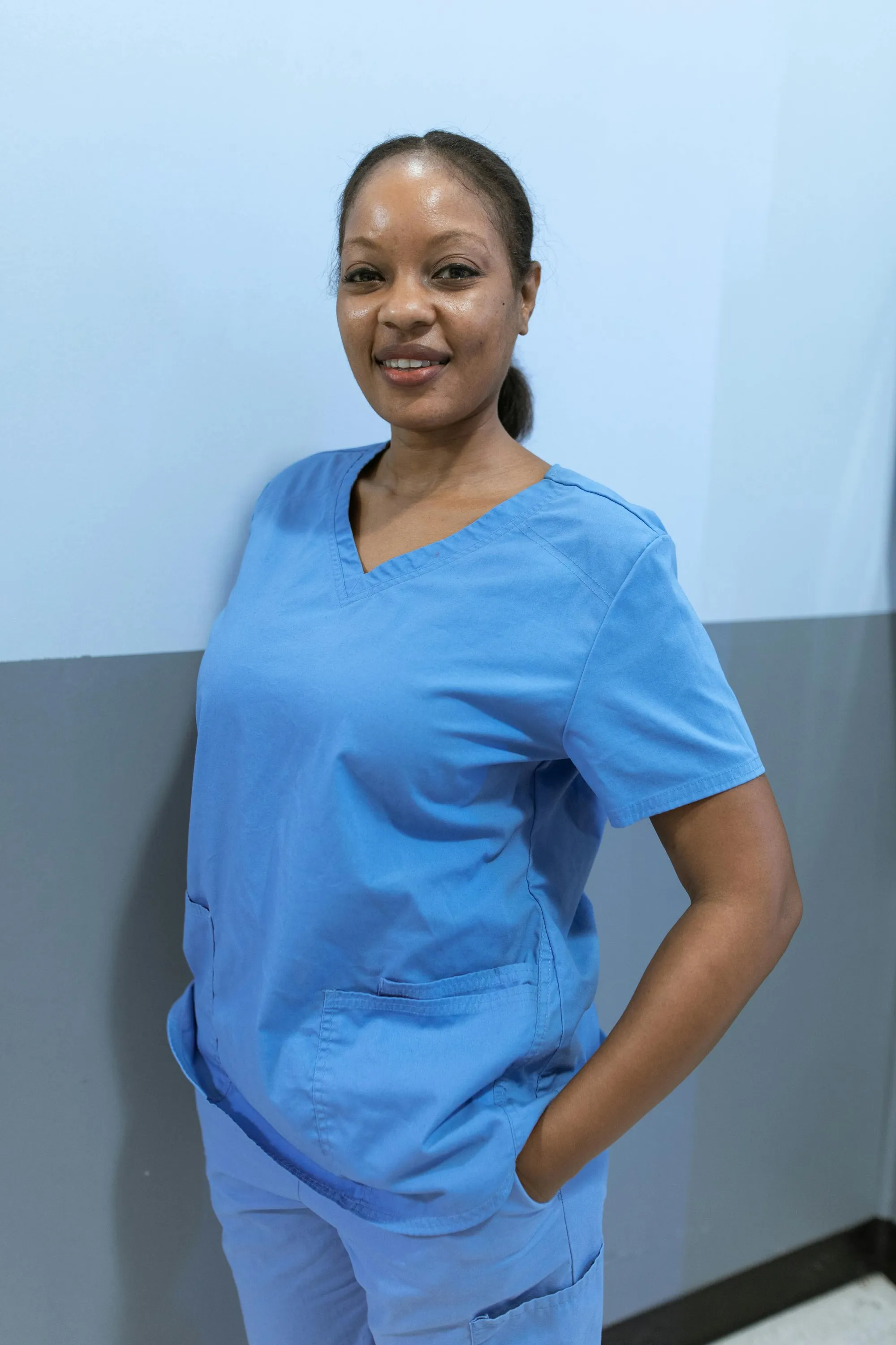 A smiling YOURBRAND caregiver, portrait