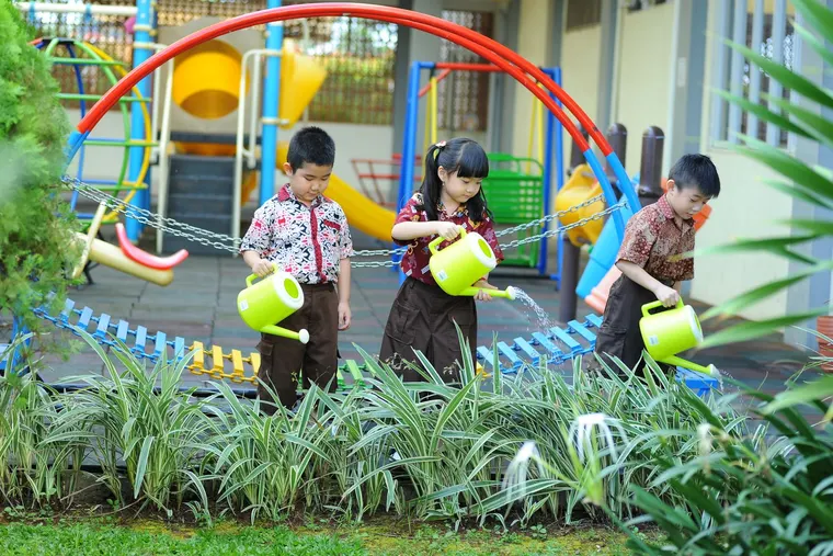 Children playing in the nursery garden
