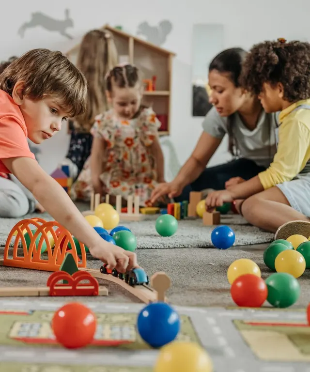 Children and an educator during a nursery visit