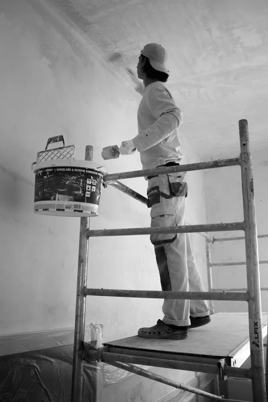 A painting and decorating business website showing a before and after project gallery and a quote request