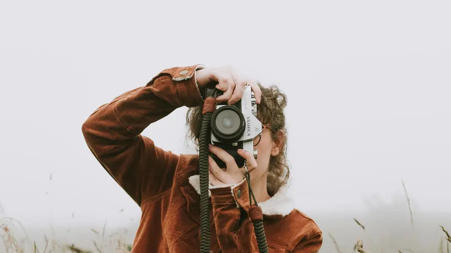 A photographer website with a full-screen portfolio, service categories and an enquiry form