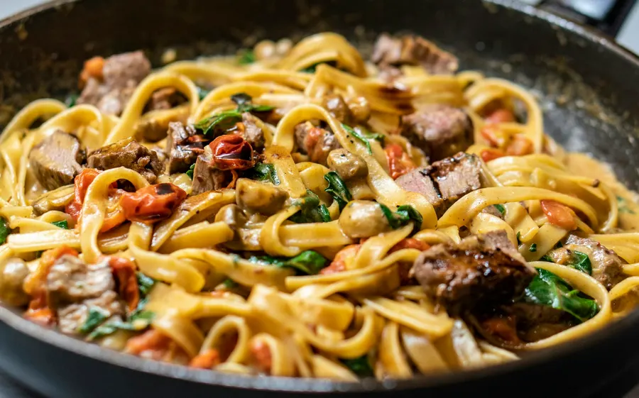 A plate of fresh tagliatelle with meat ragù