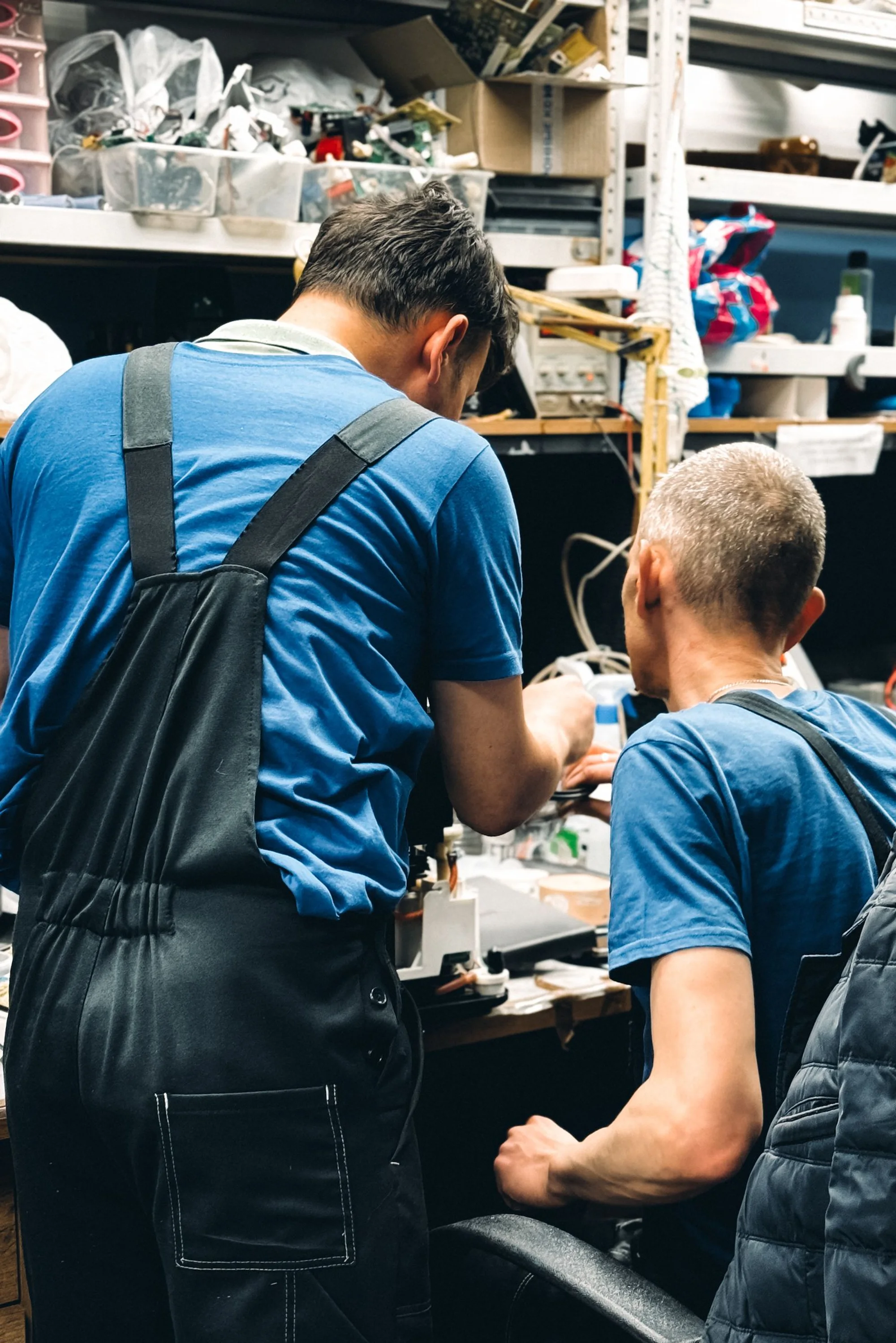 A smiling technician with a toolbox